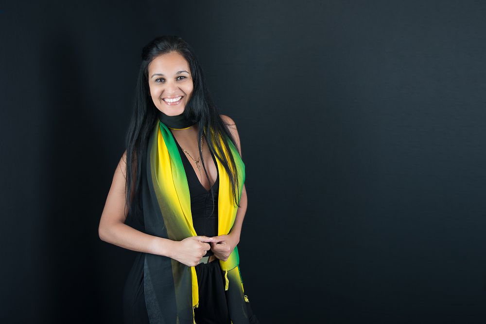 Young woman with green and yellow scarf
