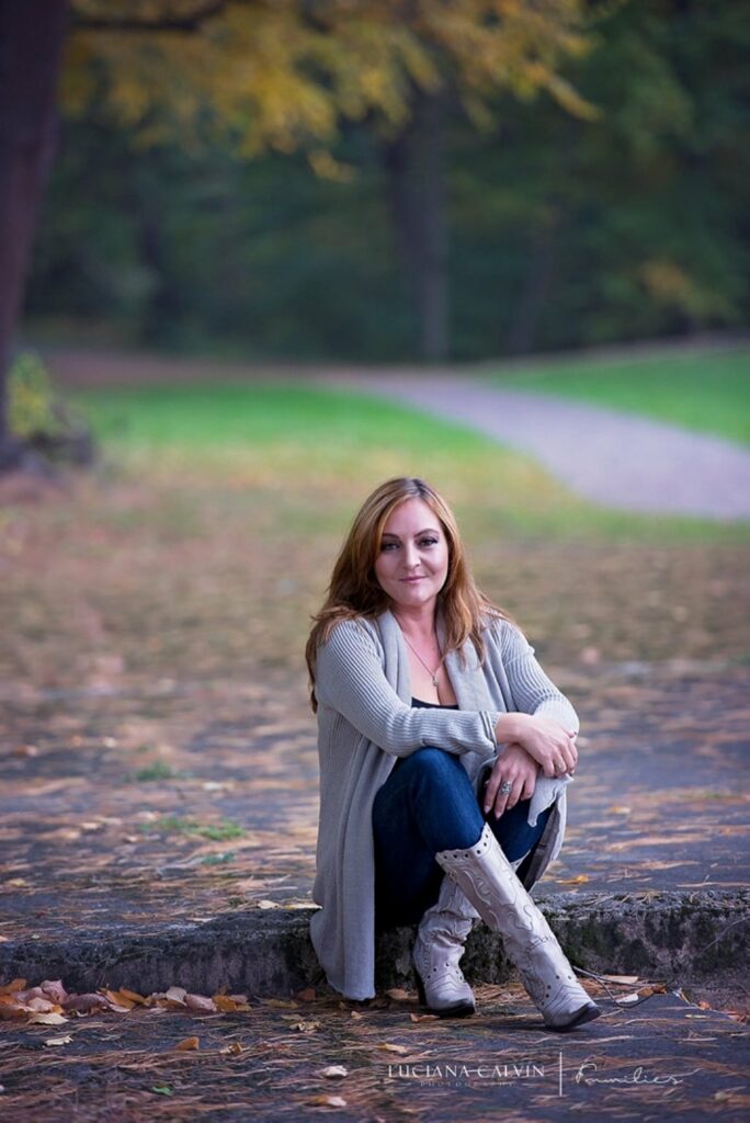 young woman under yellow tree in a walpole park