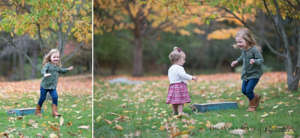 girls playing with fall leaves