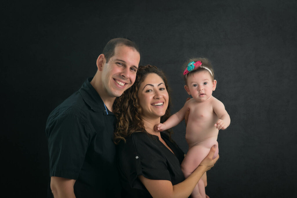 baby girl with parents