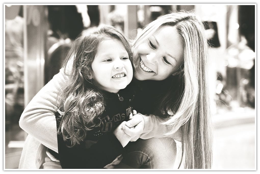 Mother and daughter laughing