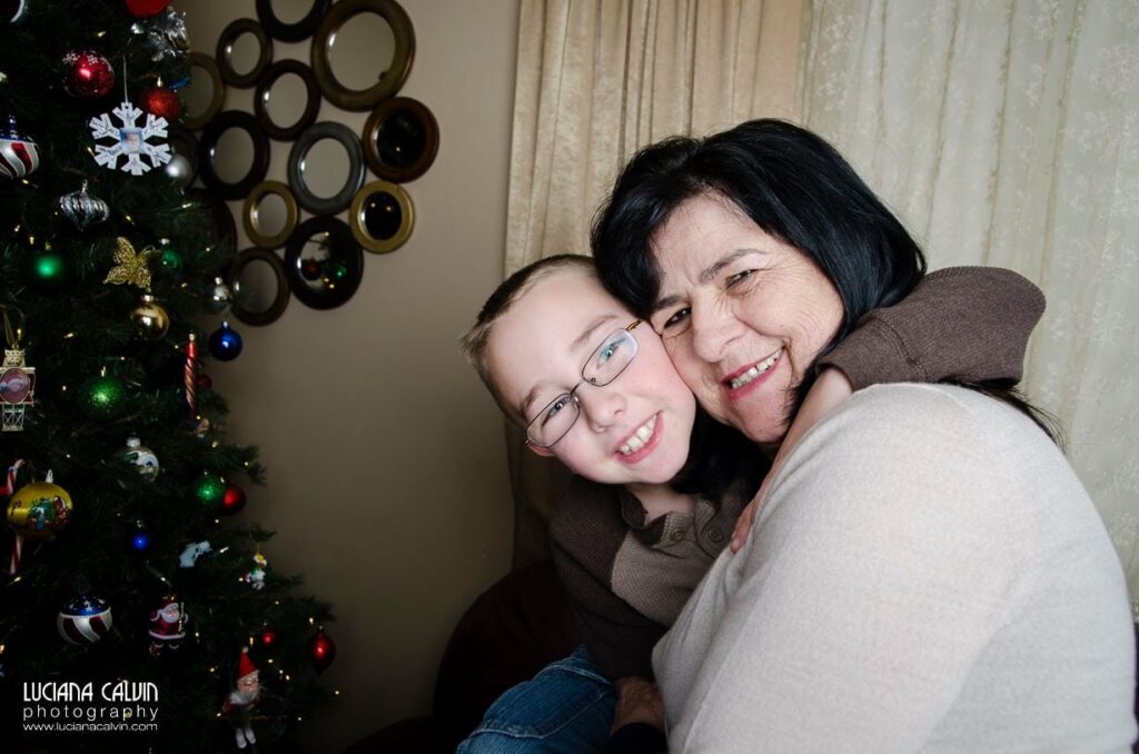 grandma being hugged by grandson