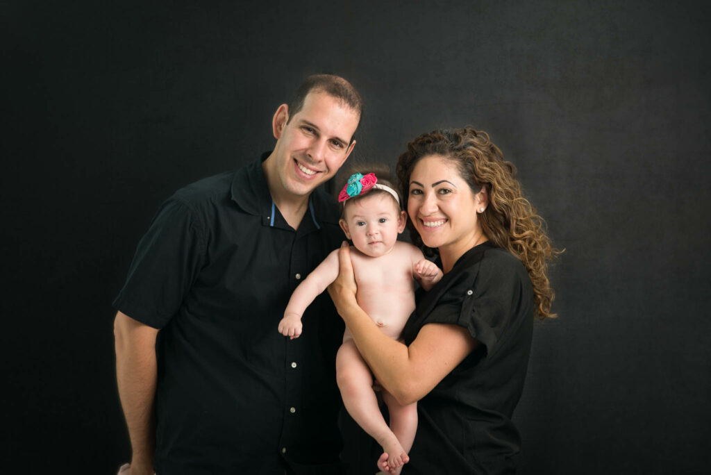 baby girl with parents