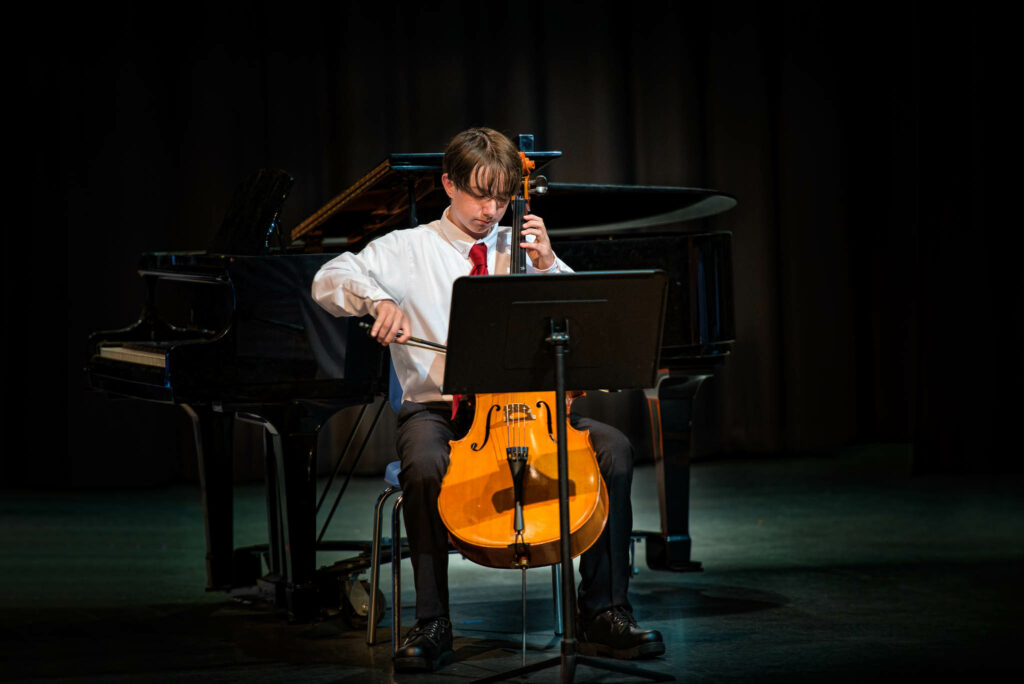 Teen playing cello
