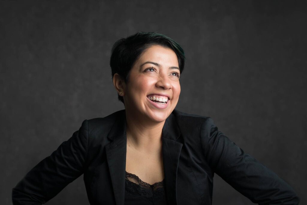 woman on a suit laughing