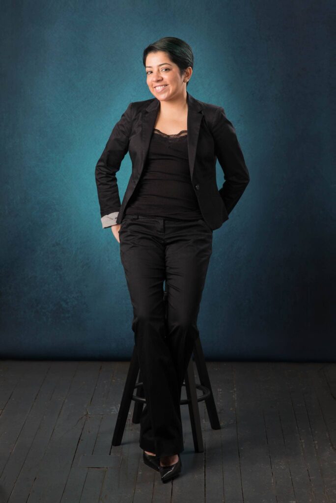 professional woman seating on a stool