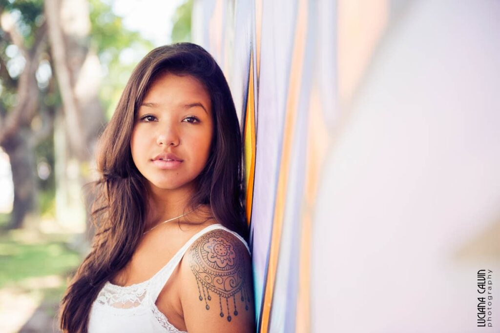 Teen on in front of a graffiti wall in Curitiba Brazil