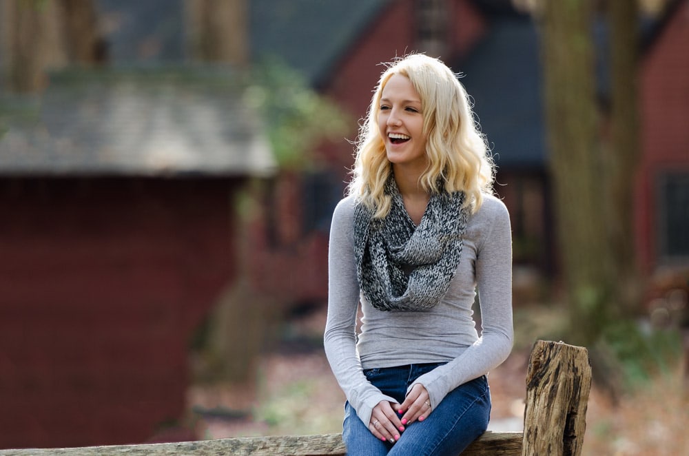 high school senior portrait with red barn