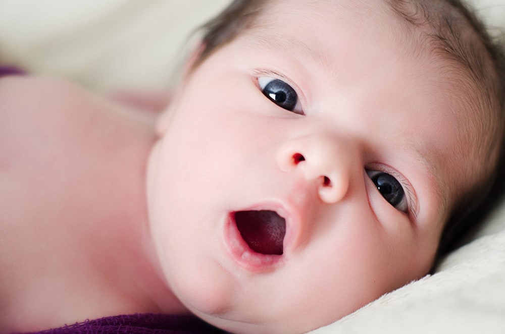 Newborn baby smiling