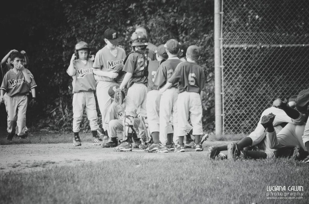 boy on baseball game  with team