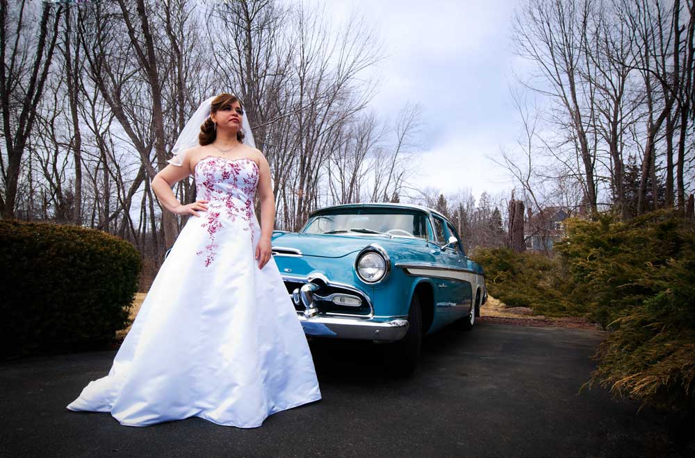 Bride with vintage car