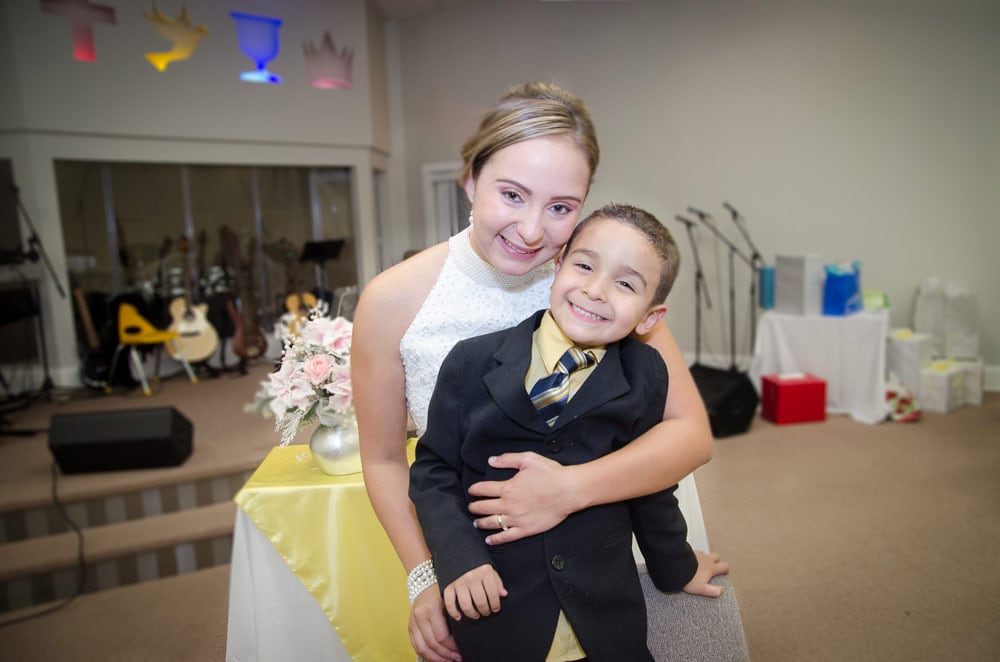 bride with nephew on wedding reception