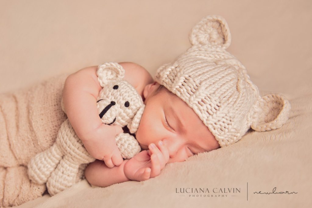 newborn sleeping with a little stuffed animal newborn sleeping with a little stuffed animal