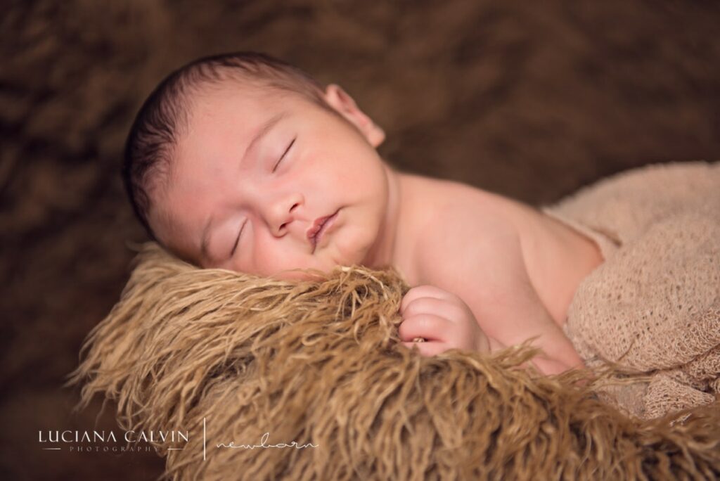 newborn baby sleeping on a basket newborn baby sleeping on a basket