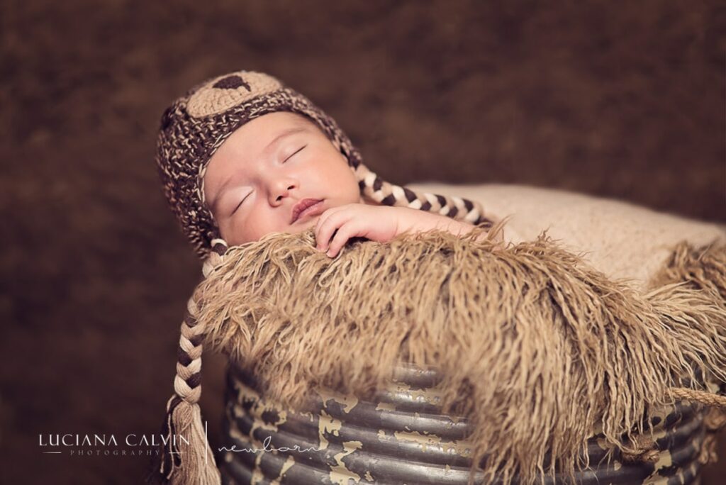 newborn baby sleeping on a basket newborn baby sleeping on a basket