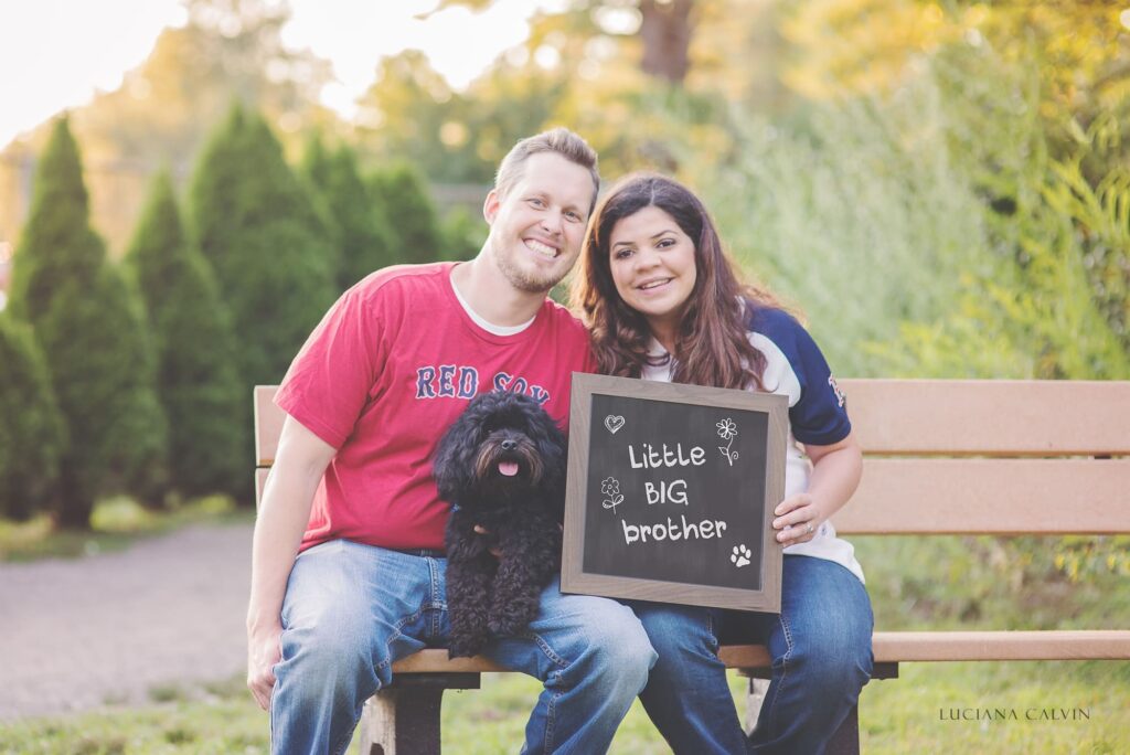 Pregnant couple with a dog