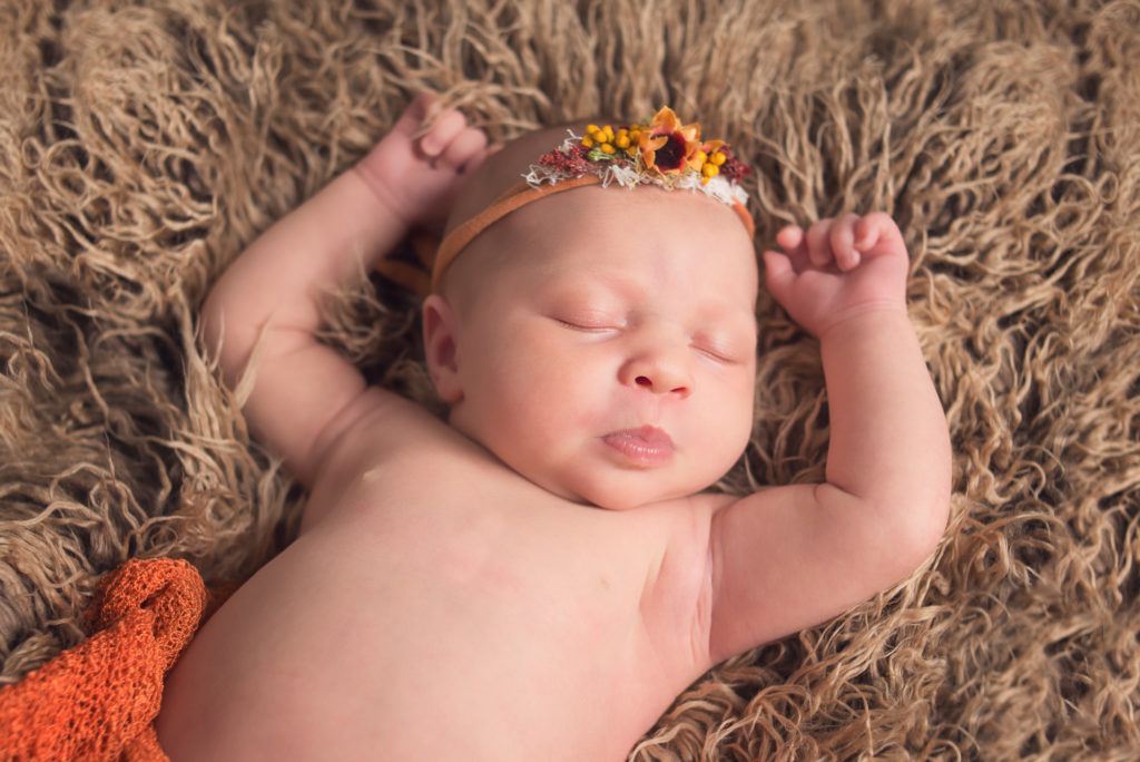baby sleeping with arms up