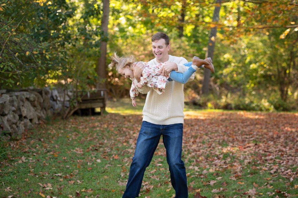 a man holding a child in his arms