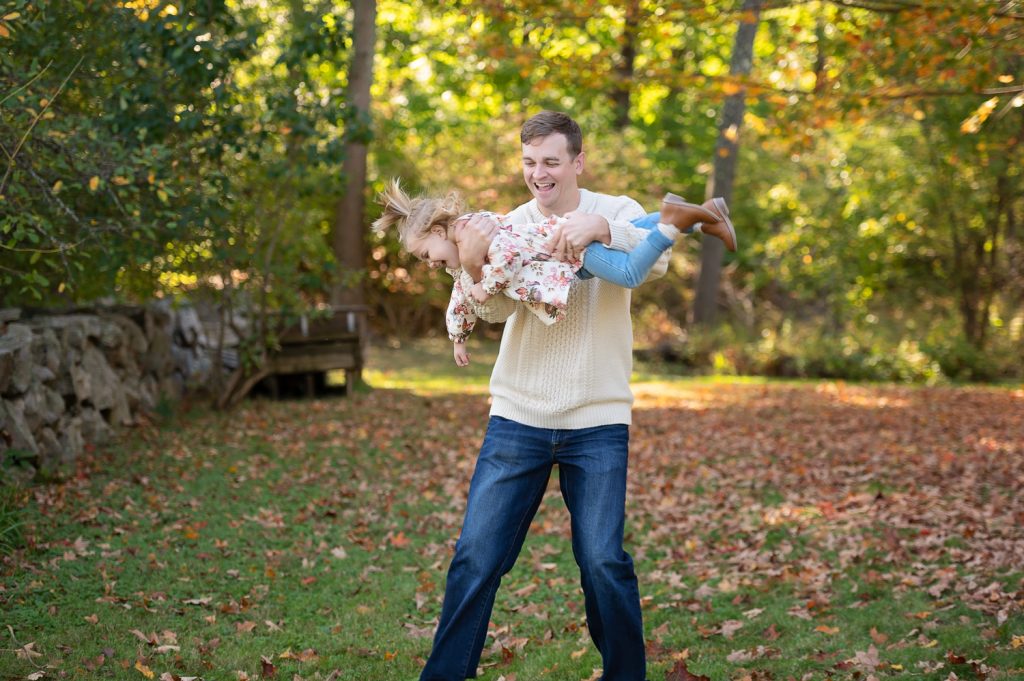 a man holding a child in his arms