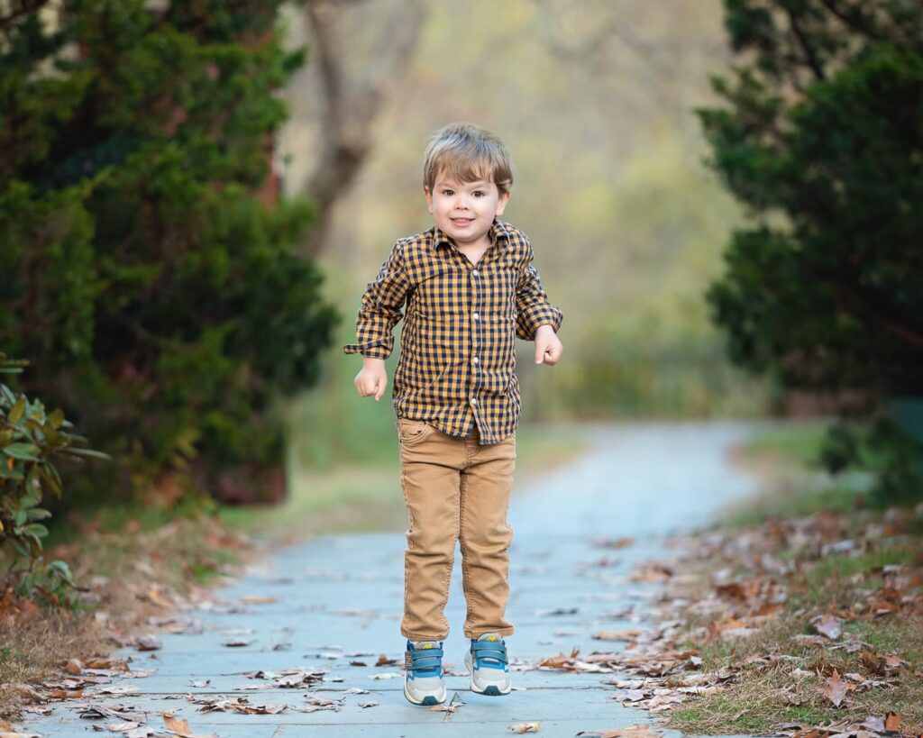a boy walking on a path