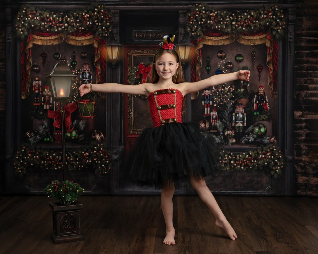 a girl in a tutu and red dress