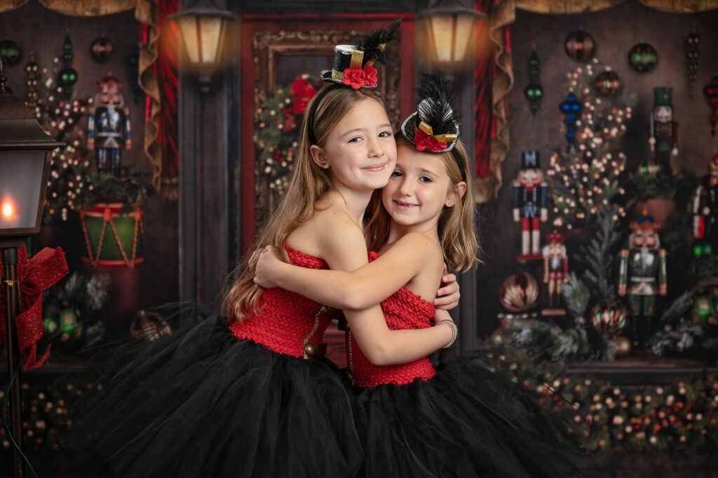 two girls in tutu dresses hugging
