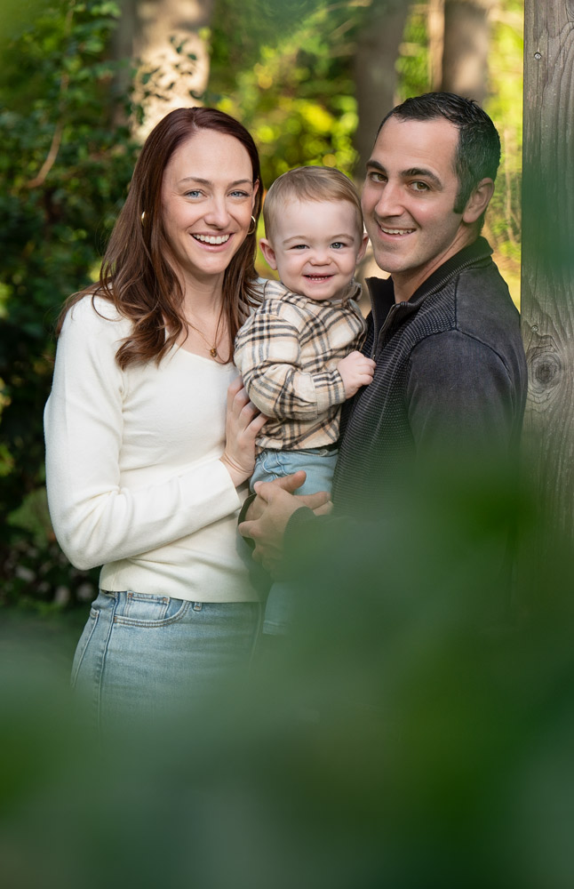 Studio family portrait of parents holding baby in Chelmsford MA