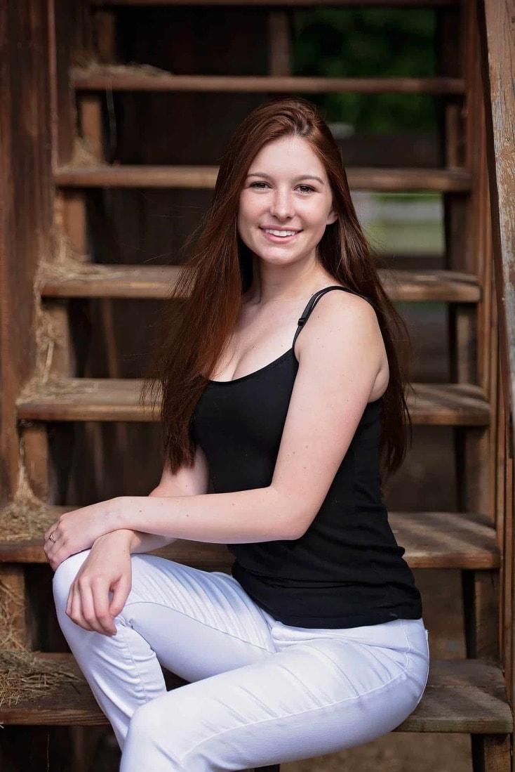Senior portrait on rustic barn stairs near chelmsford, ma